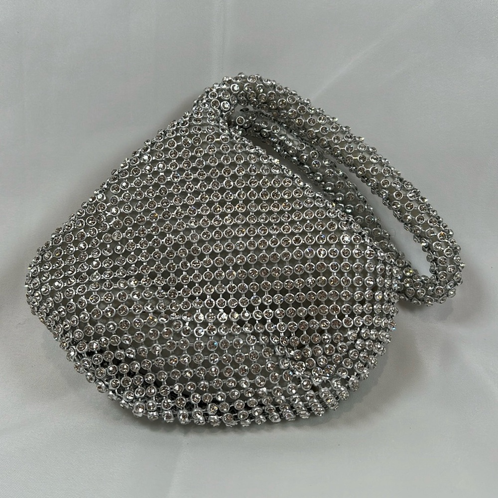 NWOT Silver rhinestone wristlet.